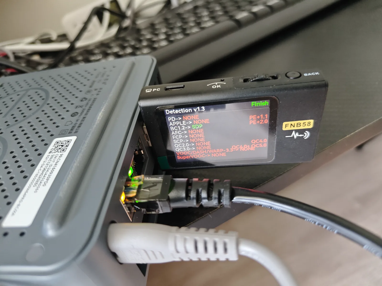 Physical wall power meter connected to the EQi12 test setup