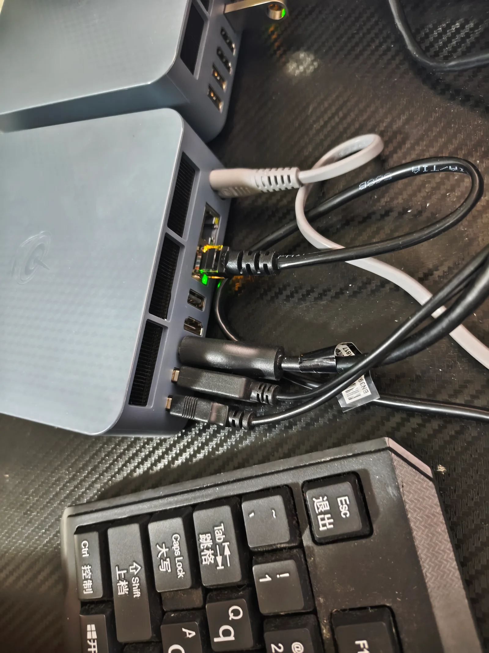 Close-up of mini PC rear panel showing dual Ethernet ports and other connectors