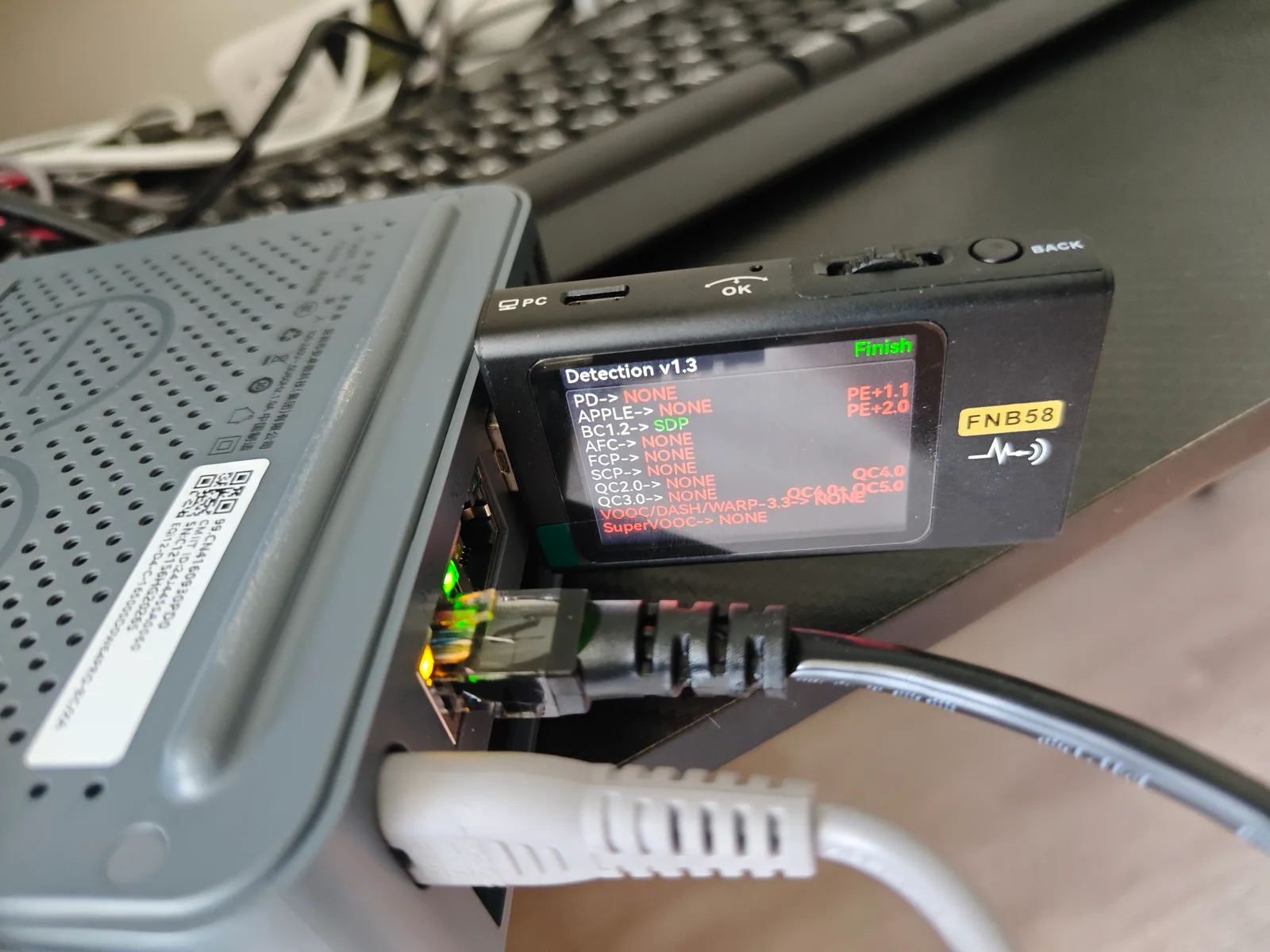 Rear I/O of the Beelink EQi12 with a power tester connected